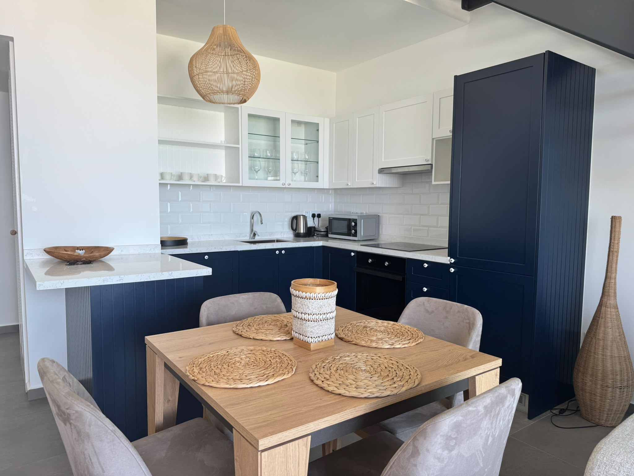 Open-plan kitchen and dining area inside Rose B10 1-bedroom residence