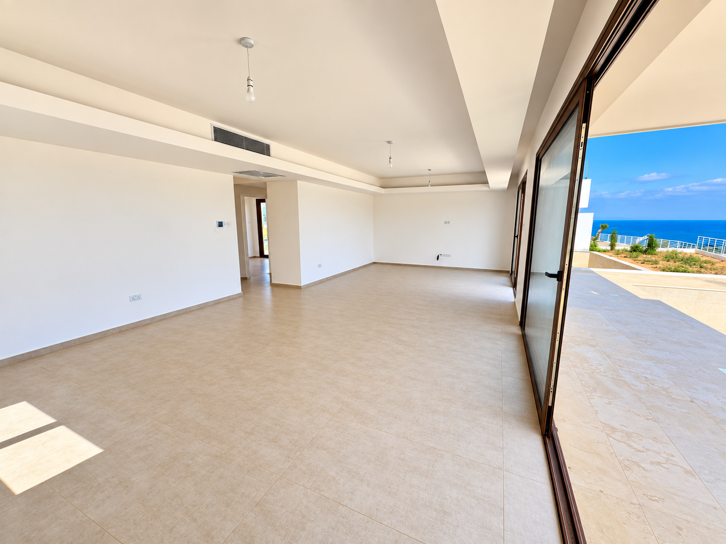 Heaven’s Hill Villa 3 ground-floor living area opening onto the terrace and Mediterranean views